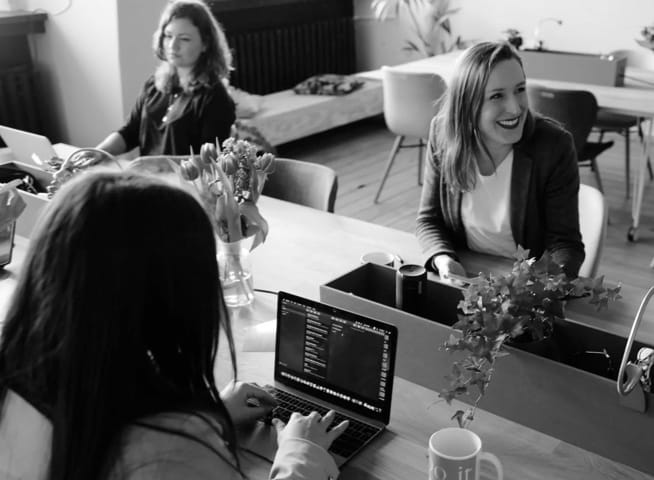 A picture of people in an office.